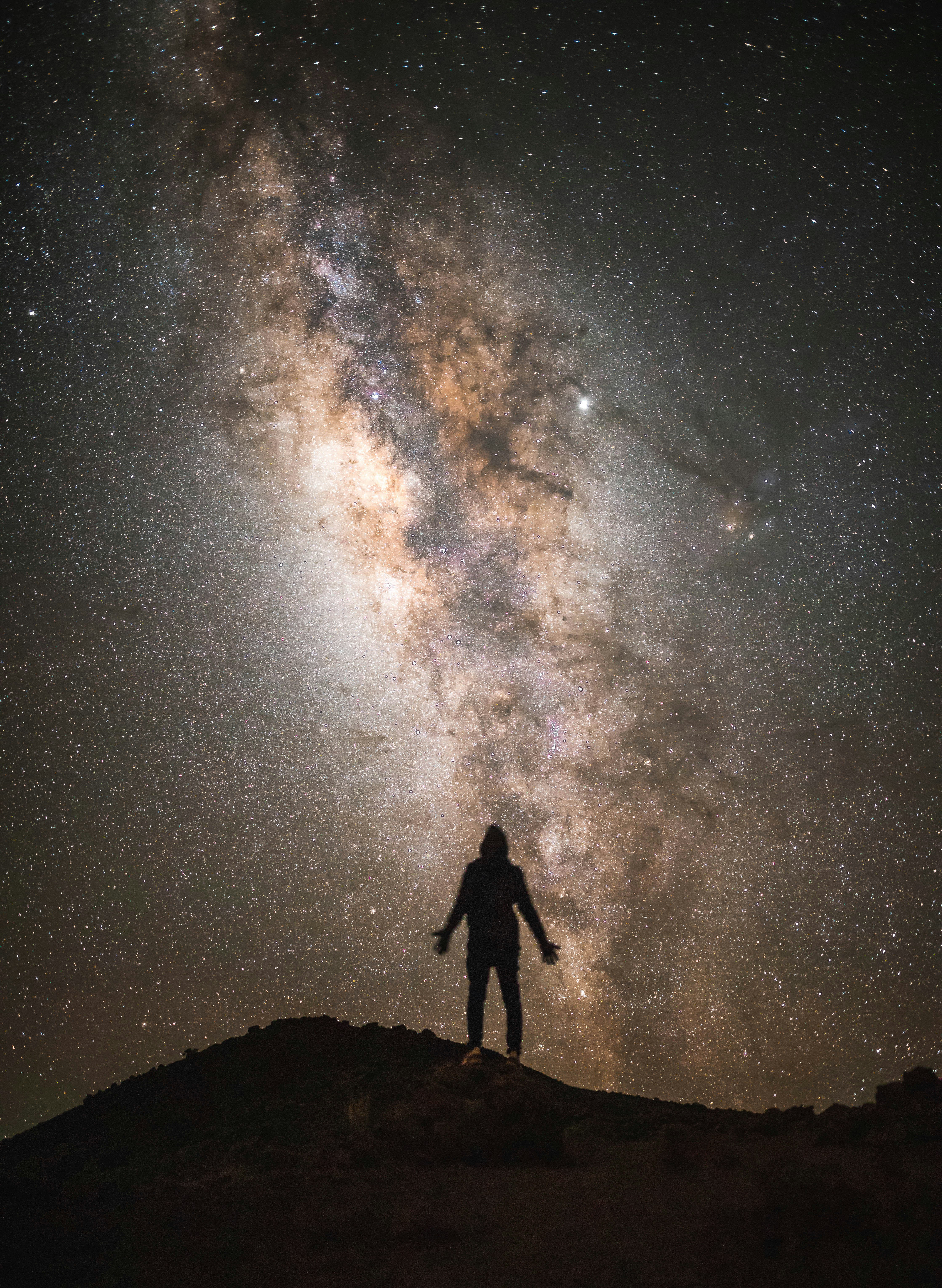 silhouette of a man with the Milky Way background